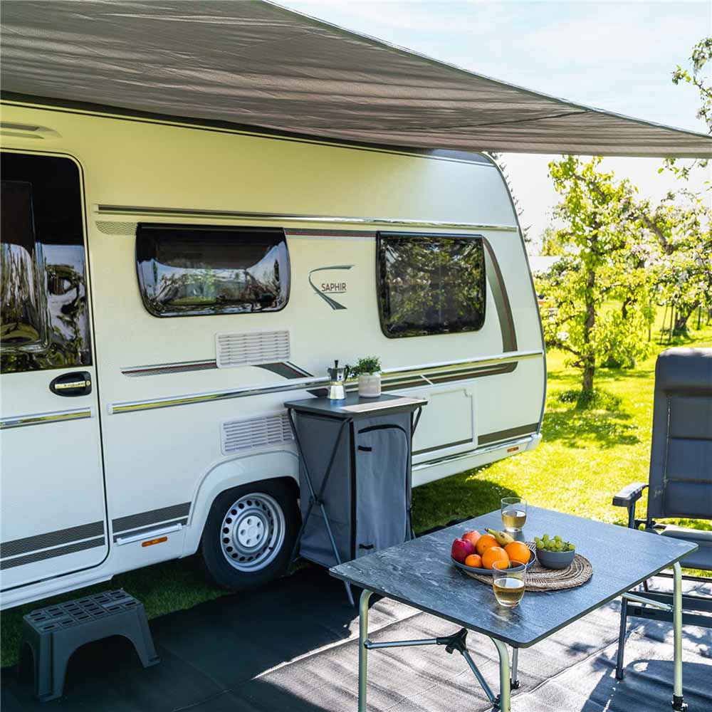 Caravan parked at campground in Hawkes Bay with caravan awning and accessories set up