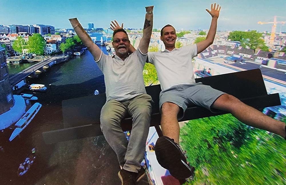 Bob and Andre Spiekerman from Smile Caravans on fun ride with hands and legs in the air